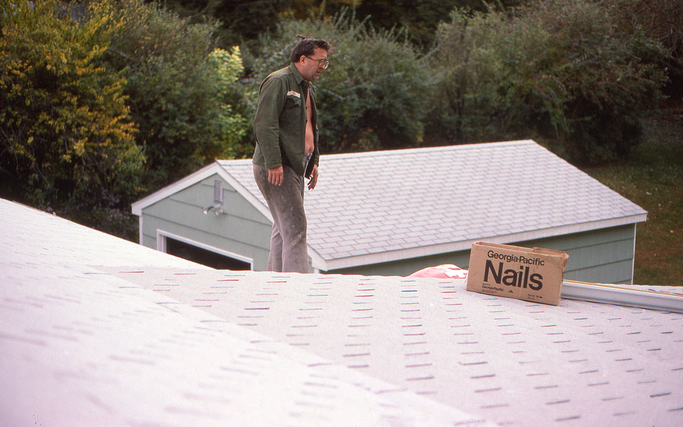 Dad up on the roof